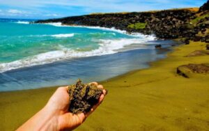 A woman holding a Green Sand from the Beach 